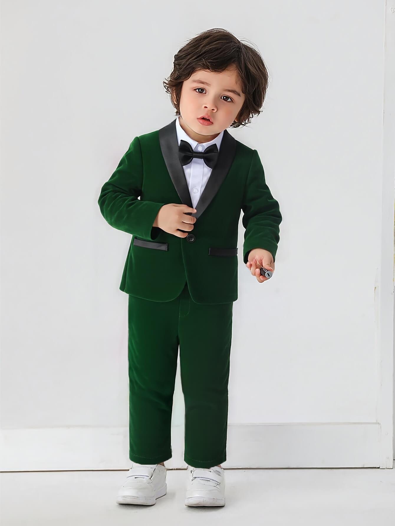 Green velvet wedding suit for boys with matching blazer and trousers for a stylish formal party look